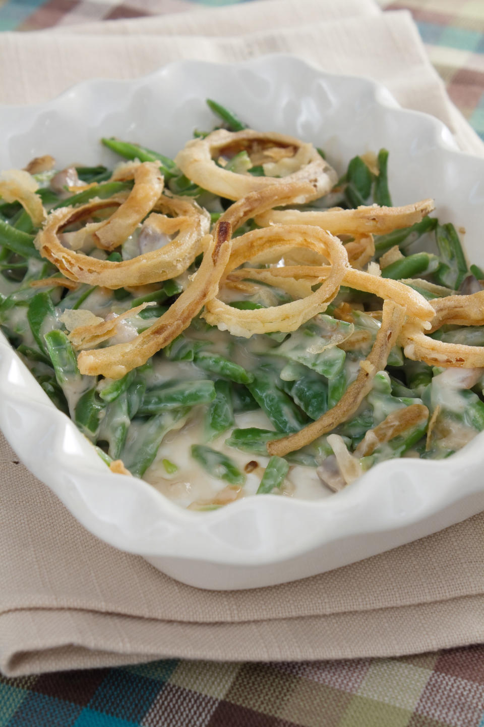 Green bean casserole with crispy fried onions.