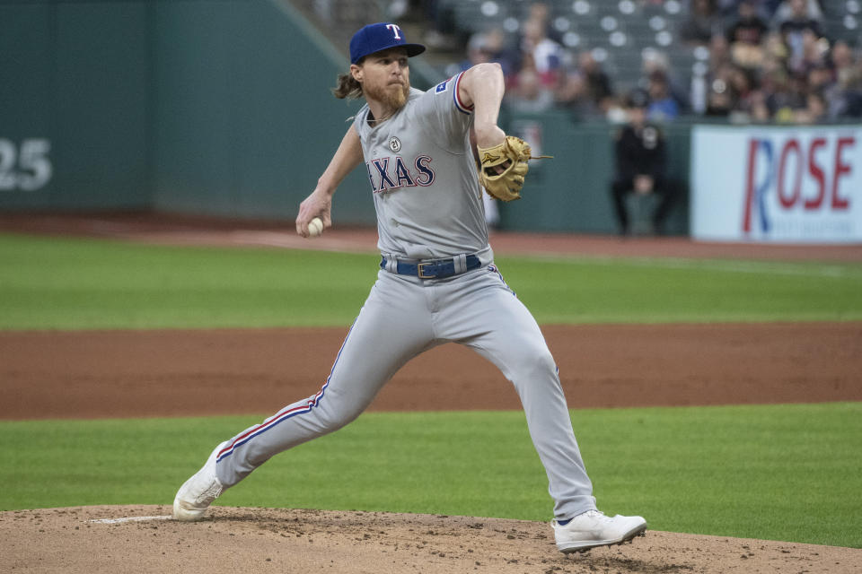 Texas Rangers starting pitcher Jon Gray delivers against the Cleveland Guardians during the first inning of a baseball game in Cleveland, Friday, Sept. 15, 2023. (AP Photo/Phil Long)