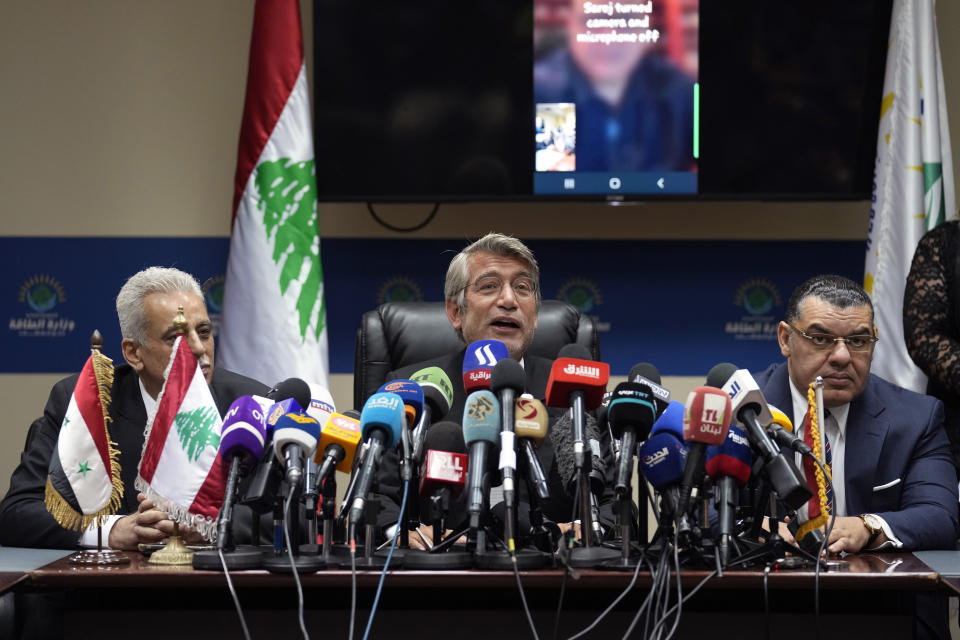 Lebanon's Energy Minister Walid Fayyad, center, Director General of the Syrian General Petroleum Corporation Nabih Khrestin, left, and Egyptian ambassador to Lebanon Yasser Elwi, give a press conference after they sign deals to bring gas from Egypt through Syria to Lebanon, at the Ministry of Energy and Water in Beirut, Lebanon, Tuesday, June 21, 2022. (AP Photo/Bilal Hussein)