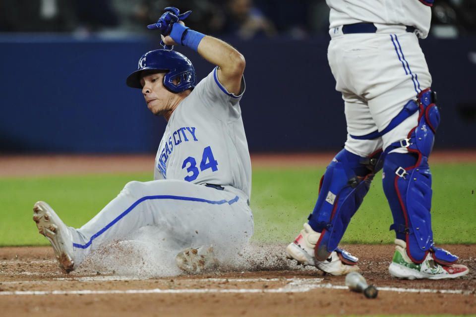 Kansas City Royals' Freddy Fermin scores against the Toronto Blue Jays during the seventh inning of a baseball game Friday, Sept. 8, 2023, in Toronto. (Nathan Denette/The Canadian Press via AP)