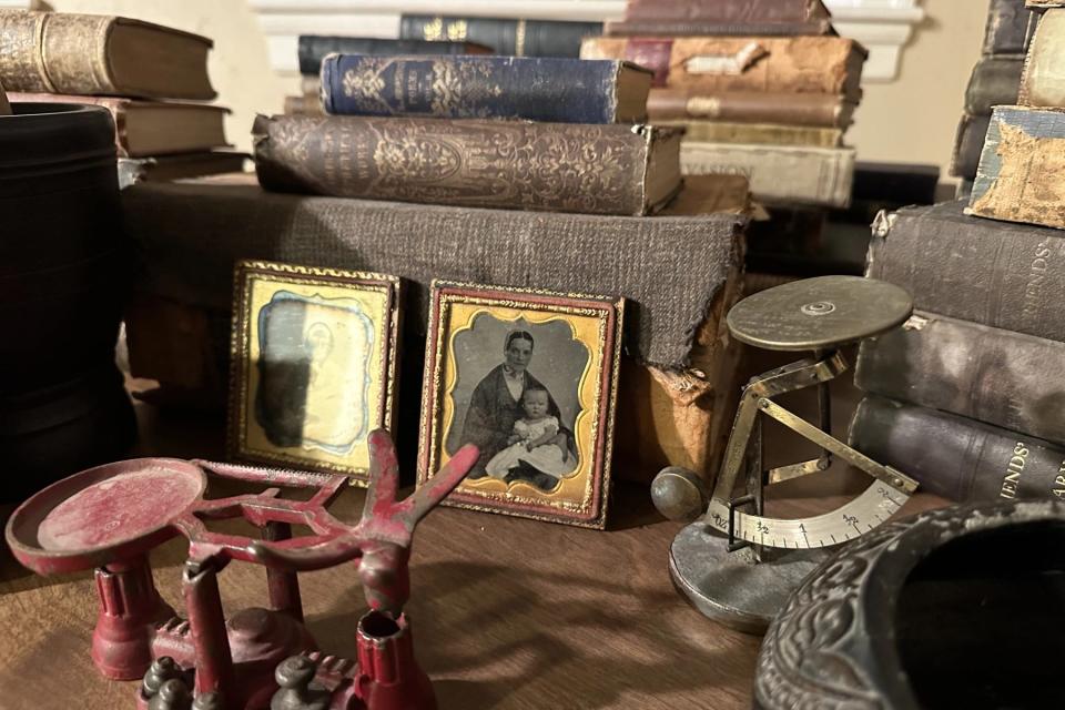 Items once owned by Dr. Isaac Fiske of Fall River, including books, family photos, and medical devices, were donated to the Preservation Society of Fall River by a distant relative.