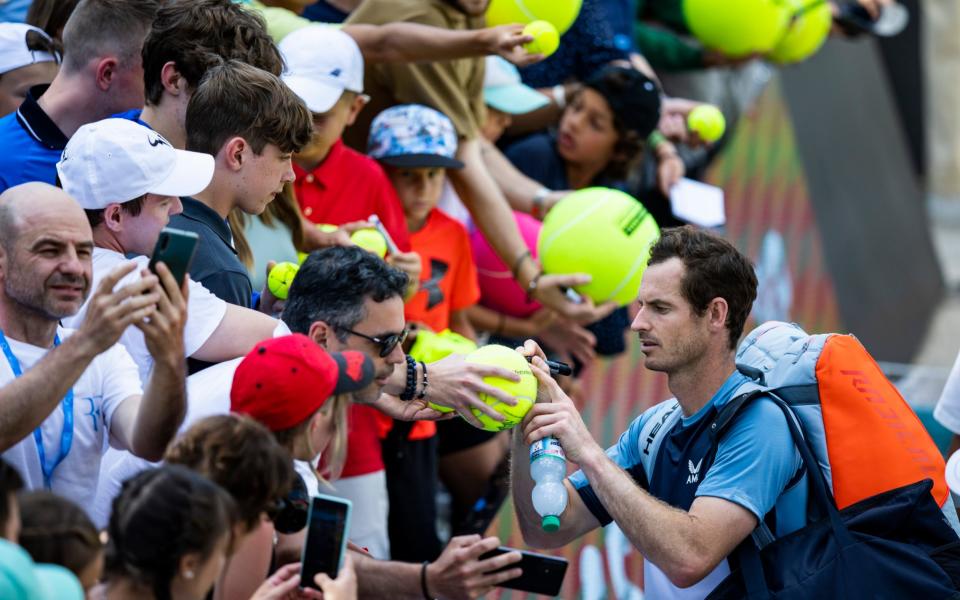 Andy Murray signs autographs after his ATP tennis semifinals match against Australia's Nick Kyrgios in Stuttgart - Tom Weller/dpa via AP