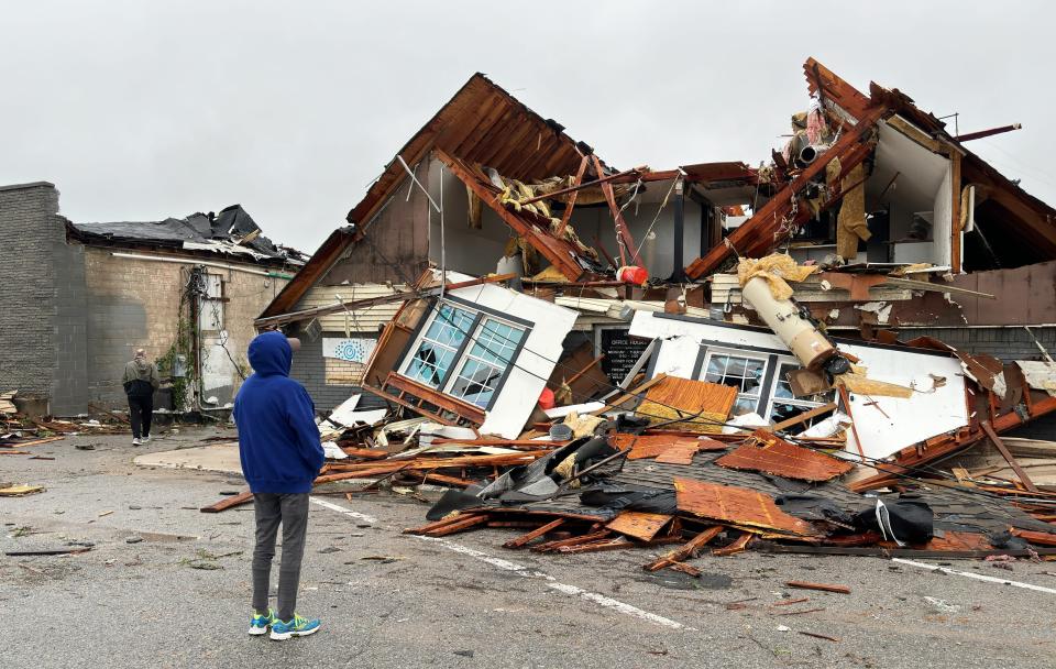A resident views damage from storms that tore through Sulphur, Oklahoma, on April 27, 2024.