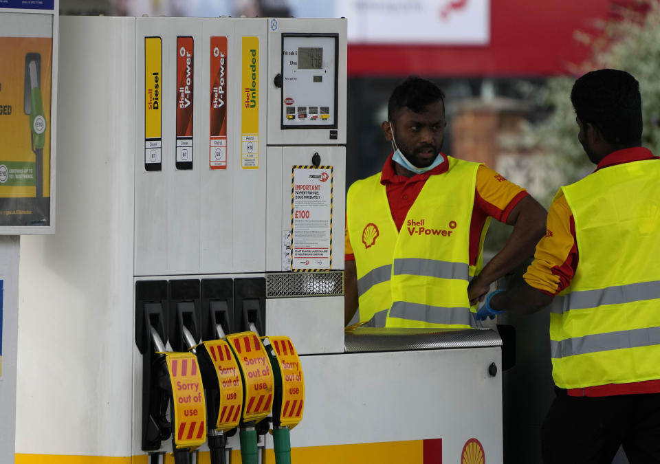 Closed fuel pumps at a petrol station in London, Tuesday, Sept. 28, 2021. Long lines of vehicles have formed at many gas stations around Britain since Friday, causing spillover traffic jams on busy roads. (AP Photo/Frank Augstein)