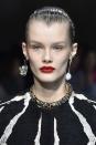 <p><strong>Trend: bold red lips</strong></p><p>For the Alexander McQueen show, the dramatic nature of the red lipstick was enhanced not only by a satin finish but because the rest of the make-up was completely pared back. </p>