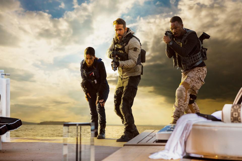 Adria Arjona (far left), Ryan Reynolds and Corey Hawkins play members of a secretive vigilante squad in "6 Underground."