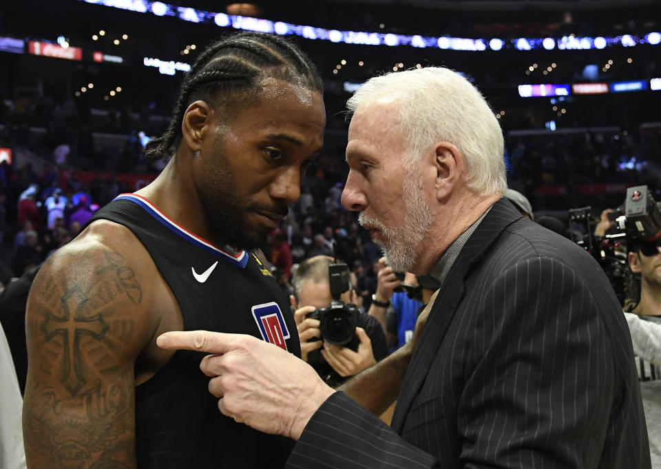 Head coach Gregg Popovich of the San Antonio Spurs talks with Kawhi Leonard #2 of the Los Angeles Clippers after the basketball game at Staples Center on October 31, 2019 in Los Angeles, California. NOTE TO USER: User expressly acknowledges and agrees that, by downloading and/or using this Photograph, user is consenting to the terms and conditions of the Getty Images License Agreement. (Photo by Kevork Djansezian/Getty Images)