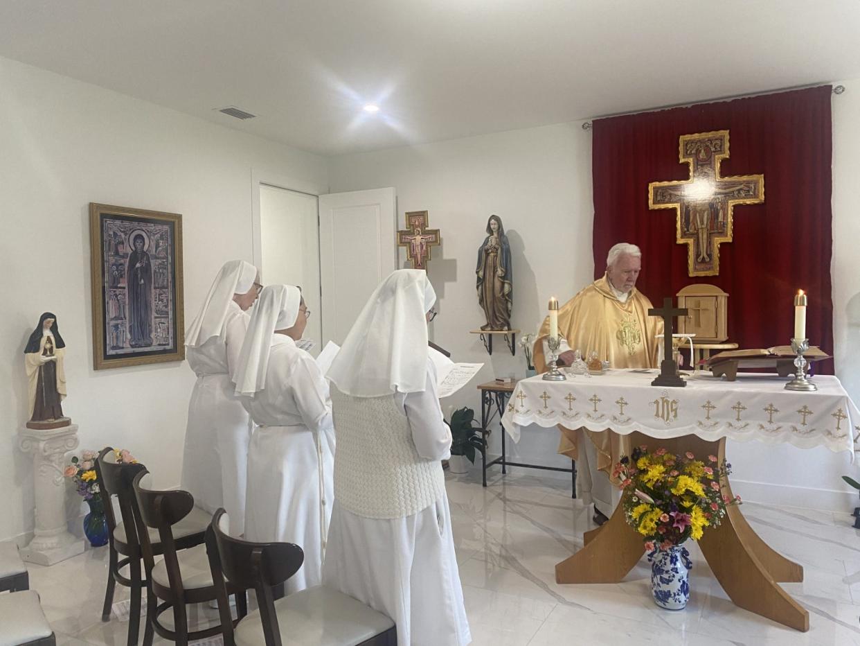 Sisters of the order of St. Clare pray in their converted chapel in their Naples home.