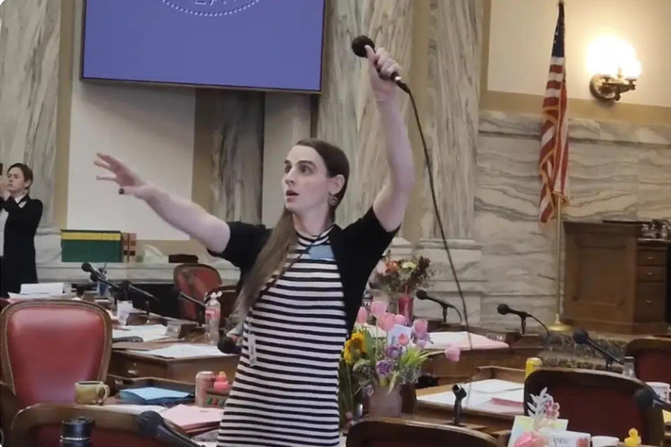 Montana Democratic Rep. Zooey Zephyr hoists a microphone into the air on Monday, April 24, 2023, as her supporters interrupt proceedings in the state House by chanting “Let Her Speak!” in Helena, Mont. (AP Photo/Amy Beth Hanson, File)