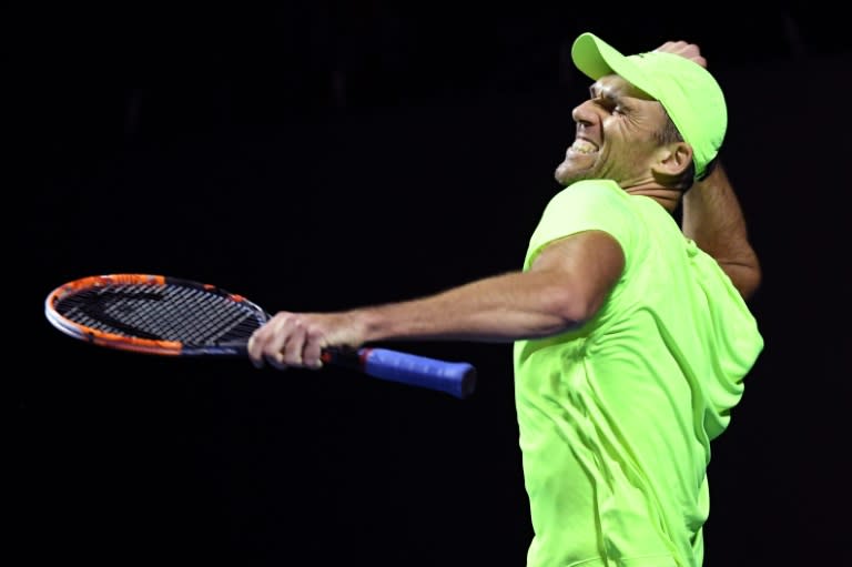 Croatia's Ivo Karlovic celebrates his win against Argentina's Horacio Zeballos on day two of the Australian Open in Melbourne on January 17, 2017