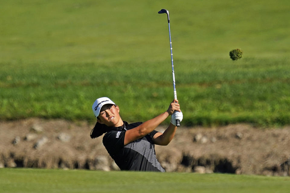 Ruoning Yin, of China, hits her pitch onto the 18th green during the first round of the Dana Classic LPGA golf tournament Thursday, Sept. 1, 2022, at Highland Meadows Golf Club in Sylvania, Ohio. (AP Photo/Gene J. Puskar)