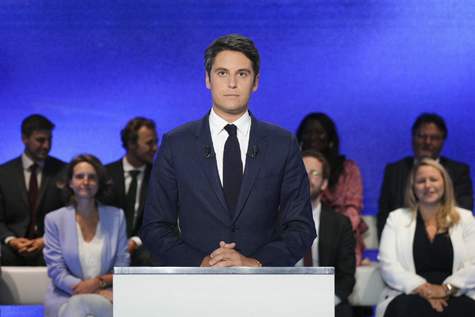 French Prime Minister Gabriel Attal poses prior to a debate broadcasted on French TV channel TF1, in Boulogne-Billancourt, outside Paris, Tuesday, June 25, 2024. The two-round parliamentary election will take place on June 30 and July 7. (Dimitar Dilkoff, Pool via AP)