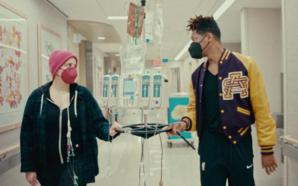 Jon Batiste with Suleika Jaouad in hospital in Netflix documentary American Symphony