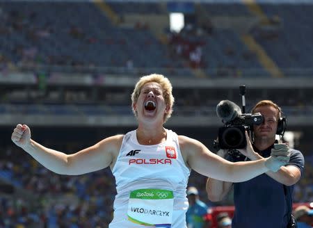 2016 Rio Olympics - Athletics - Final - Women's Hammer Throw Final - Olympic Stadium - Rio de Janeiro, Brazil - 15/08/2016. Anita Wlodarczyk (POL) of Poland reacts after setting a new world record. REUTERS/Gonzalo Fuentes