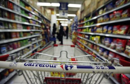 A Carrefour supermarket logo is seen on a shopping trolley at a branch in Beijing December 4, 2011. REUTERS/Soo Hoo Zheyang