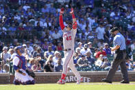 Washington Nationals' Joey Meneses celebrates his homer off Chicago Cubs starting pitcher Justin Steele as catcher Yan Gomes and home plate umpire Mike Muchlinski watch during the sixth inning of a baseball game Wednesday, Aug. 10, 2022, in Chicago. (AP Photo/Charles Rex Arbogast)