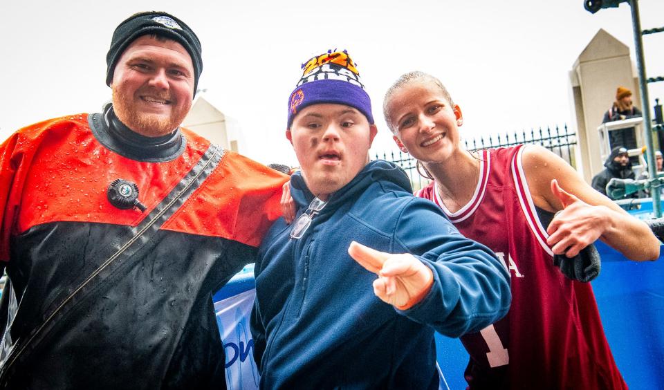 Indiana University Police Department officer and Monroe County dive team member Chris Brummett, left, Sky Simpson, middle, and Special Olympics Regional Manager Madison Ferguson pose together at the 2024 Polar Plunge benefitting Special Olympics Indiana at Memorial Stadium on Saturday, Feb. 24, 2024.