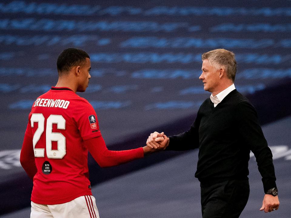 Mason Greenwood with coach Ole Gunnar Solskjaer (Manchester United via Getty Images)