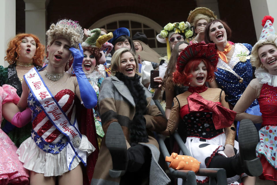 Actor and director Elizabeth Banks, center, is surrounded by student actors in drag as she is honored as the 2020 Woman of the Year by Harvard University's Hasty Pudding Theatricals, Friday, Jan. 31, 2020, in Cambridge, Mass. (AP Photo/Elise Amendola)