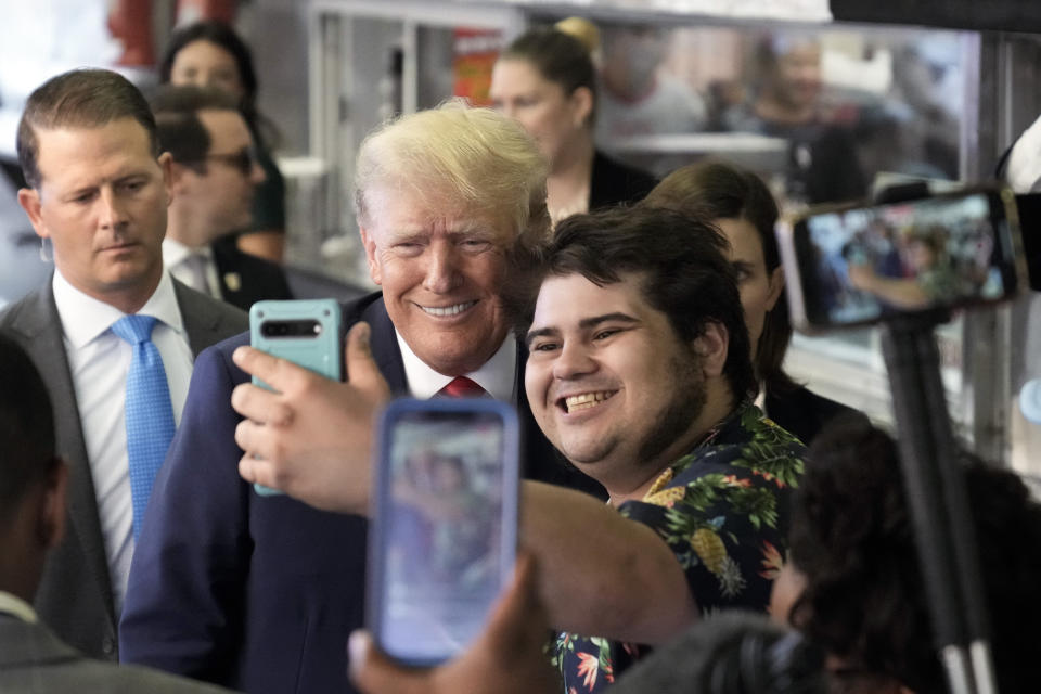 Former President Donald Trump poses for a photo as he visits Pat's King of Steaks in Philadelphia, Friday, June 30, 2023. (AP Photo/Matt Rourke)