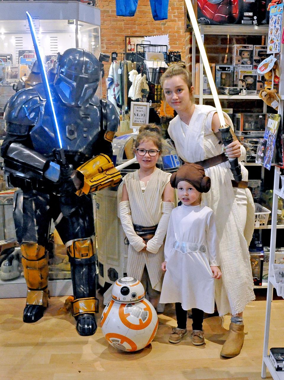 (Left to right) Rob Smith, Quinn and Maeve Gardner and McCartney Sorg pose in their Star Wars costumes at Operation Fandom on May 4. Sorg is from Orrville and cosplays, or dresses, as Star Wars characters on special occasions or for children's birthday parties.