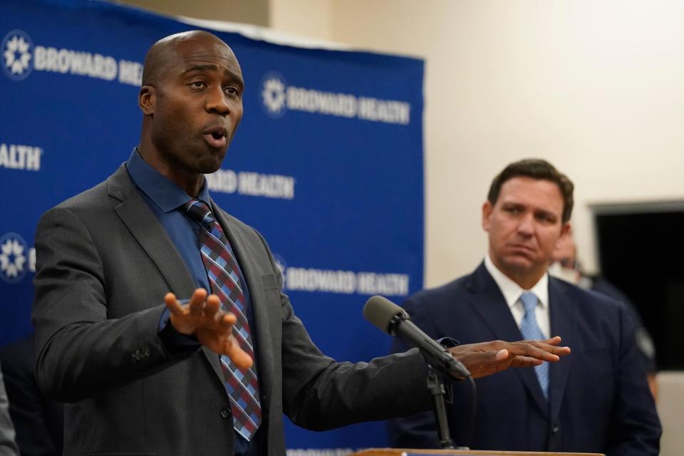 Florida Surgeon General Dr. Joseph Ladapo, left, speaks at a news conference with Florida Gov. Ron DeSantis, right, in January at Broward Health Medical Center in Fort Lauderdale.