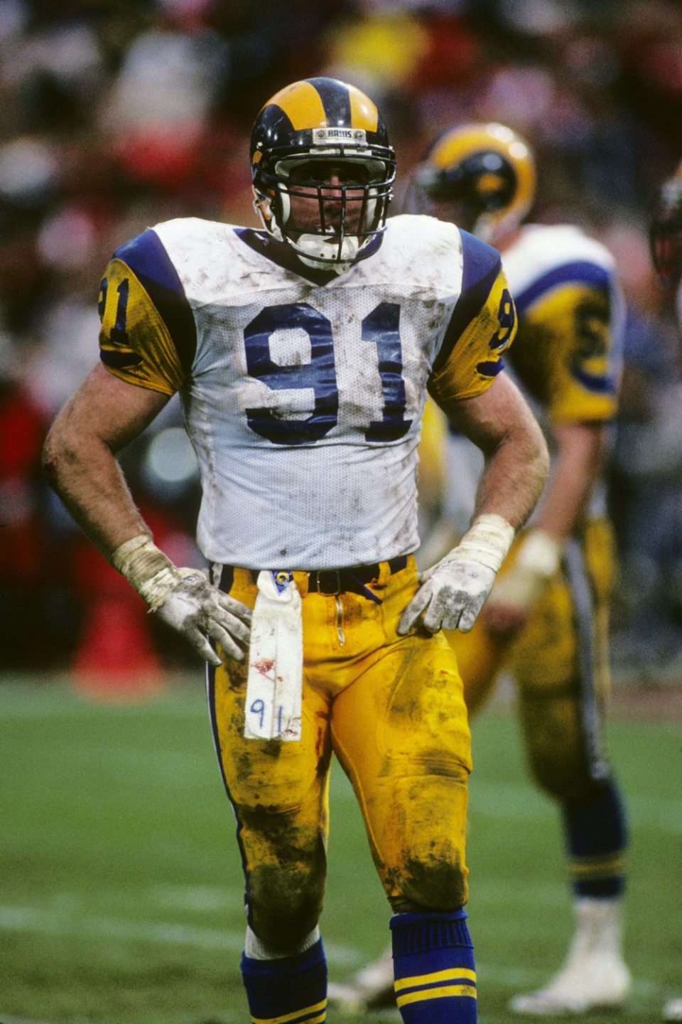 Rams linebacker Kevin Greene is covered with dirt during 1989 NFC championship game against the 49ers.