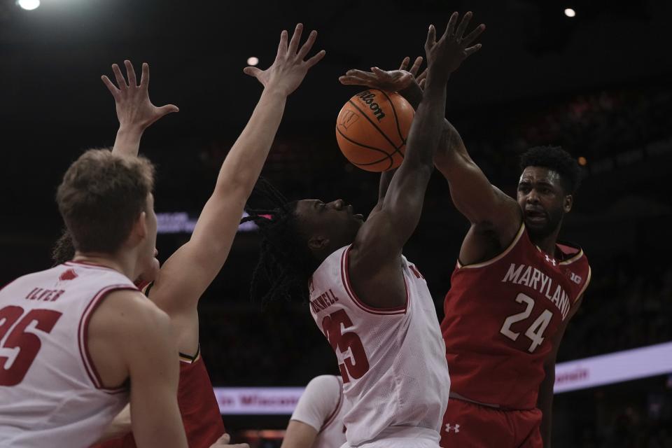 Maryland's Donta Scott fouls Wisconsin's John Blackwell during the second half of an NCAA college basketball game Tuesday, Feb. 20, 2024, in Madison, Wis. (AP Photo/Morry Gash)