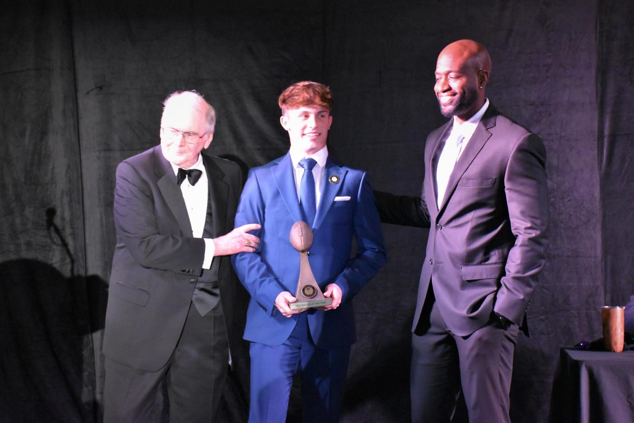 American Heritage's Jake Weinberg is congratulated on stage for winning the Lou Groza Kicker of the year award on Dec. 4, 2023.