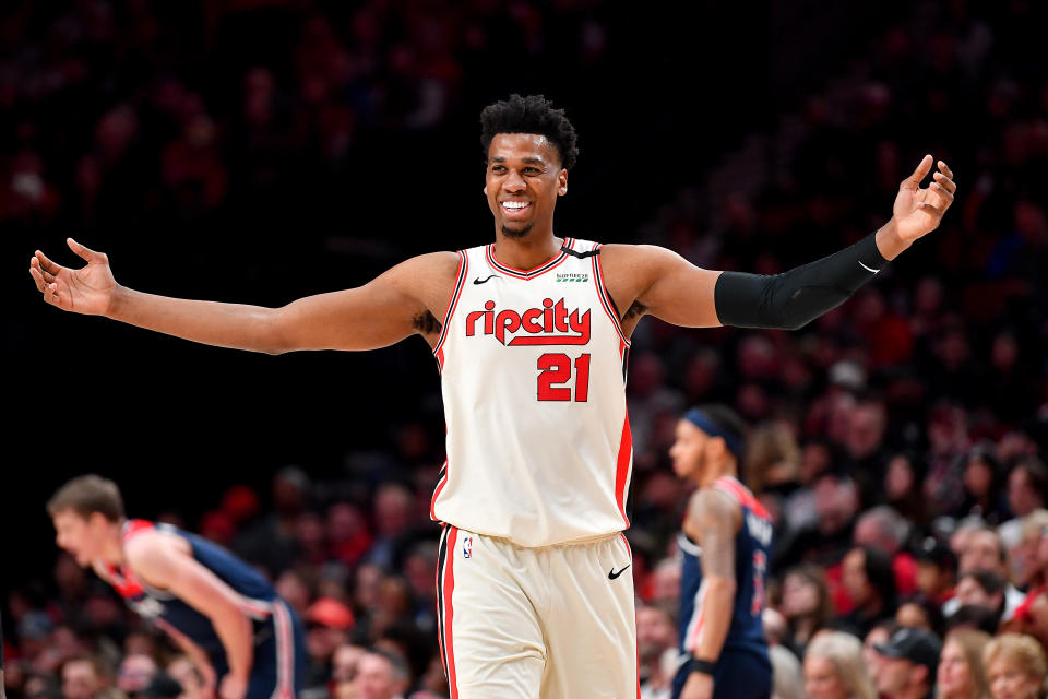 PORTLAND, OREGON - MARCH 04: Hassan Whiteside #21 of the Portland Trail Blazers is all smiles during the fourth quarter of the game against the Washington Wizards at the Moda Center on March 04, 2020 in Portland, Oregon. The Portland Trail Blazers topped the Washington Wizards, 125-105. (Photo by Alika Jenner/Getty Images)