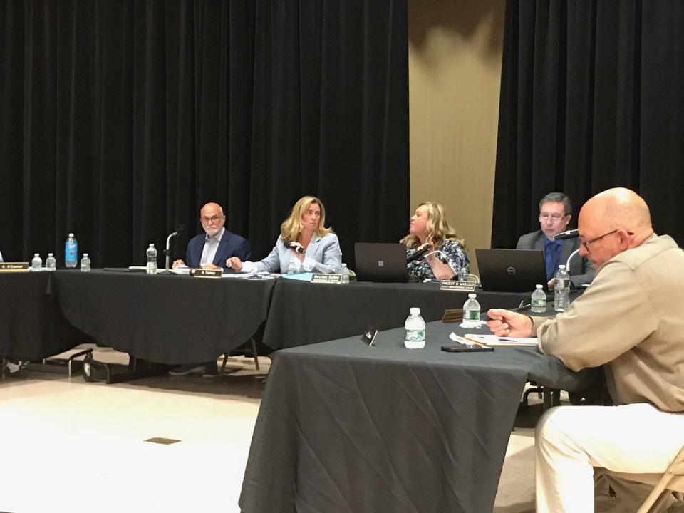 The Colts Neck Board of Education meeting on June 28, 2023, where the board tabled a parental notification policy related to student gender changes due to threats of state legal action.