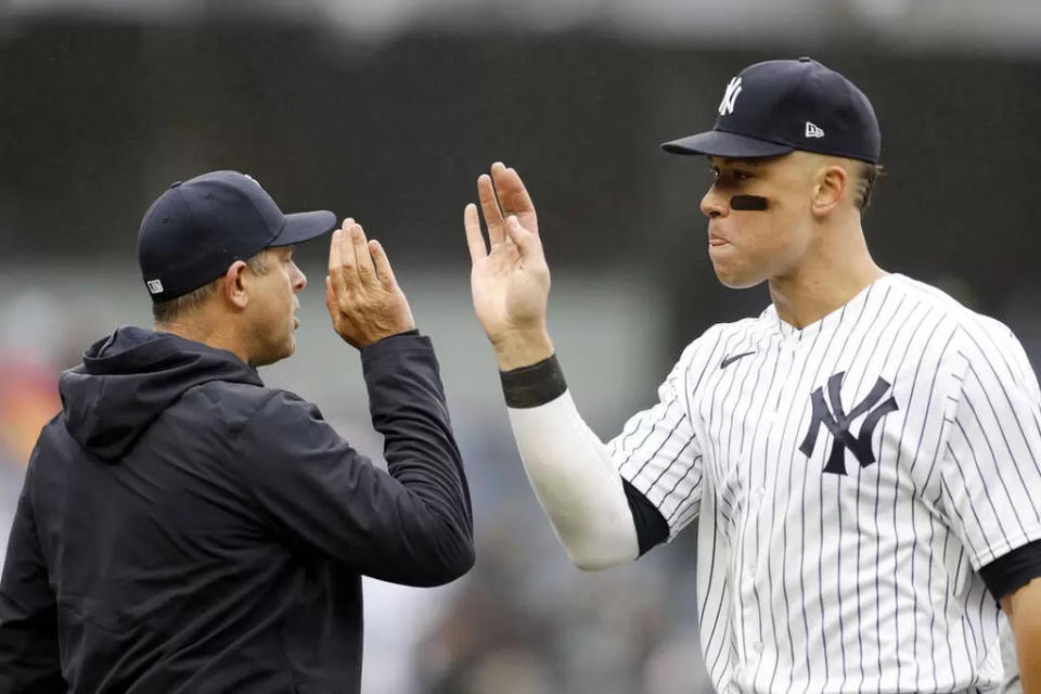 洋基總教練布恩（Aaron Boone，左）回憶簽下賈吉（Aaron Judge）往事。法新社