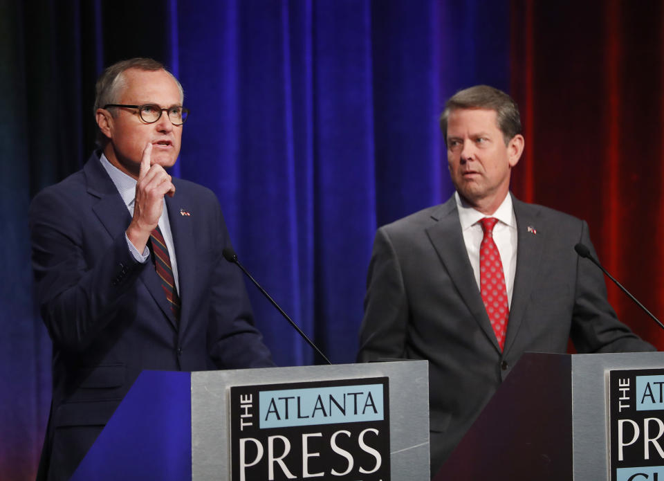 Republican candidates for Georgia Governor Georgia Lt. Gov. Casey Cagle, left, and Secretary of State Brian Kemp speak during an Atlanta Press Club debate at Georgia Public Television Thursday, July 12, 2018, in Atlanta. The two will face each other July 24 in a runoff election for the Republican nomination. (AP Photo/John Bazemore)