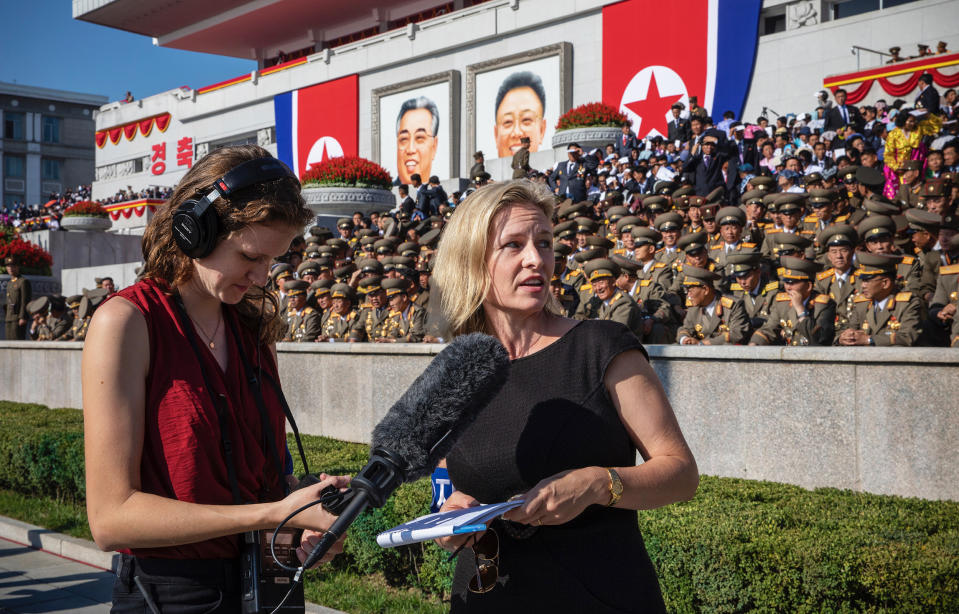 Kelly, right, travels all of the world to report for NPR. (Courtesy David Guttenfelder for NPR)