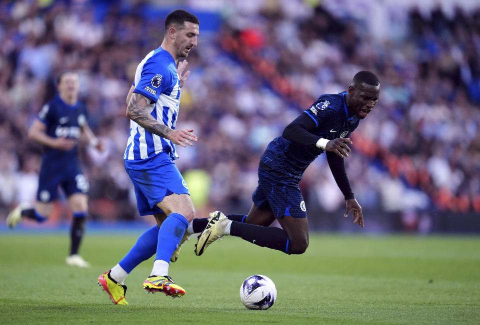 Chelsea's Nicolas Jackson, right, and Brighton and Hove Albion's Lewis Dunk, left, challenge for the ball during the English Premier League soccer match between Brighton and Hove Albion and FC Chelsea in Brighton and Hove, England, Wednesday, May 15, 2024. (Adam Davy/PA via AP)