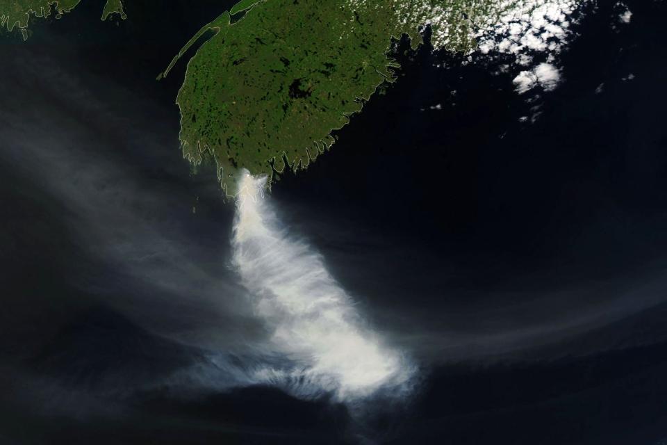 NASA’s Earth Observatory photo shows smoke billowing from fires near Shelburne, Nova Scotia, Canada. (NASA Earth Observatory/AFP via G)