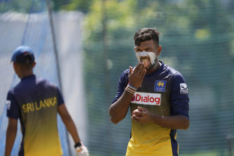 Sri Lanka's spin bowler Ramesh Mendis prepares to deliver a ball during a practice session ahead of the first test cricket match between Australia and Sri Lanka in Galle, Sri Lanka, Tuesday, June 28, 2022. (AP Photo/Eranga Jayawardena)