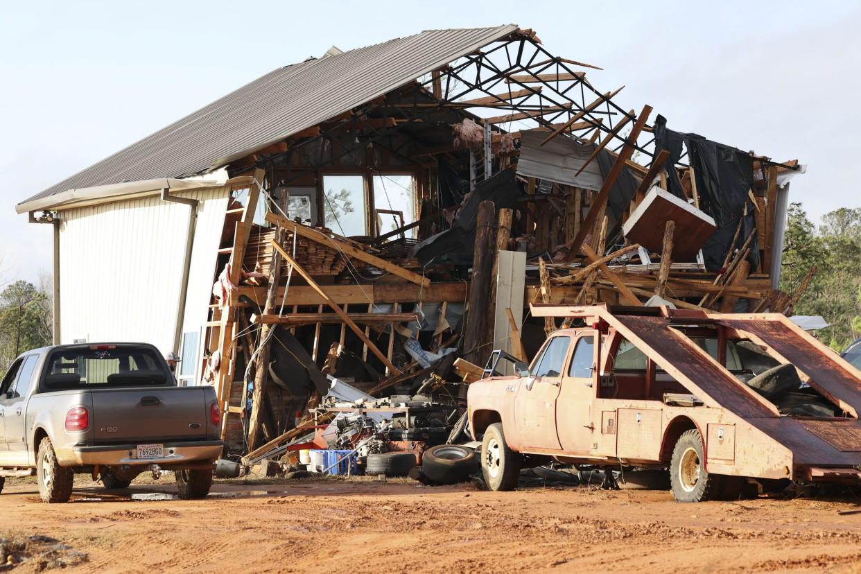 A damaged home is seen in the aftermath of severe weather, Thursday, Jan. 12, 2023, near Prattville, Ala. A large tornado damaged homes and uprooted trees in Alabama on Thursday as a powerful storm system pushed through the South. (AP Photo/Vasha Hunt)