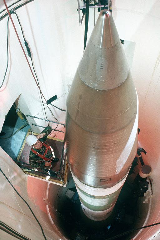 A US technician inspects an LGM-30G Minuteman III missile inside a silo about 60 miles from Grand Forks Air Force Base, in North Dakota