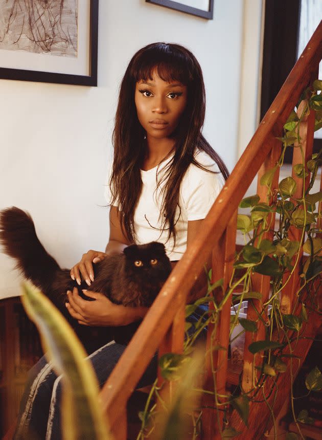 Vanniall with GMO, one of her three black cats. (Photo: <a href=