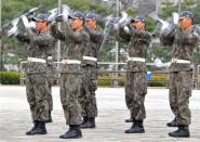 South Korean honour guards perform drills outside the War Memorial of Korea, in Seoul, in 2013