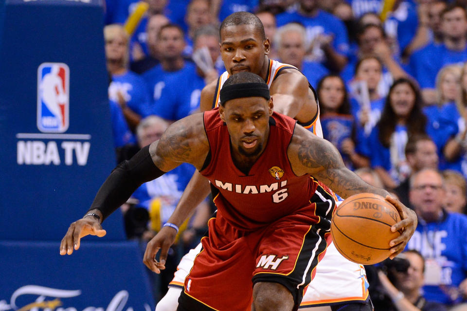 OKLAHOMA CITY, OK - JUNE 12: LeBron James #6 of the Miami Heat grabs the ball in front of Kevin Durant #35 of the Oklahoma City Thunder in the first half in Game One of the 2012 NBA Finals at Chesapeake Energy Arena on June 12, 2012 in Oklahoma City, Oklahoma. NOTE TO USER: User expressly acknowledges and agrees that, by downloading and or using this photograph, User is consenting to the terms and conditions of the Getty Images License Agreement. (Photo by Ronald Martinez/Getty Images)