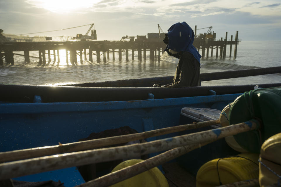 Boats are secured by fishermen preparing for the arrival of Hurricane Julia in La Libertad, El Salvador, Sunday, Oct. 9, 2022. Hurricane Julia hit Nicaragua’s central Caribbean coast on Sunday after lashing Colombia’s San Andres island, and a weakened storm was expected to emerge over the Pacific. (AP Photo/Moises Castillo)