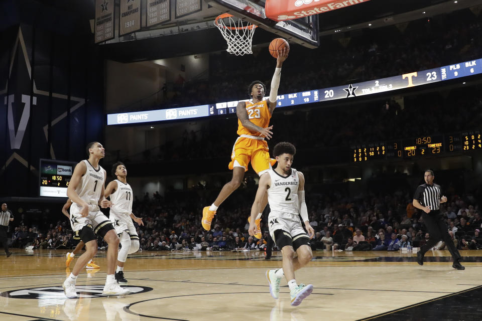 Tennessee guard Jordan Bowden (23) scores over Vanderbilt guard Scotty Pippen Jr. (2) during the second half of an NCAA college basketball game Saturday, Jan. 18, 2020, in Nashville, Tenn. (AP Photo/Mark Humphrey)