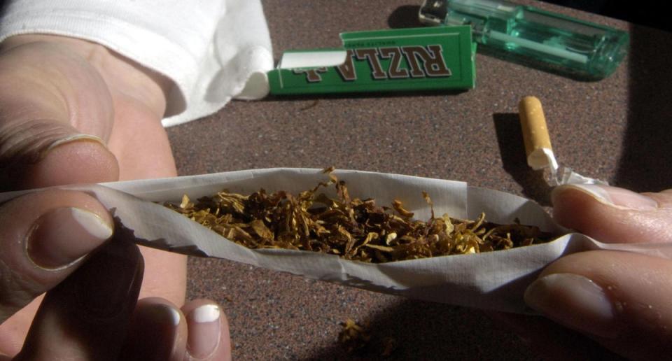 A cannabis cigarette being rolled (PA)