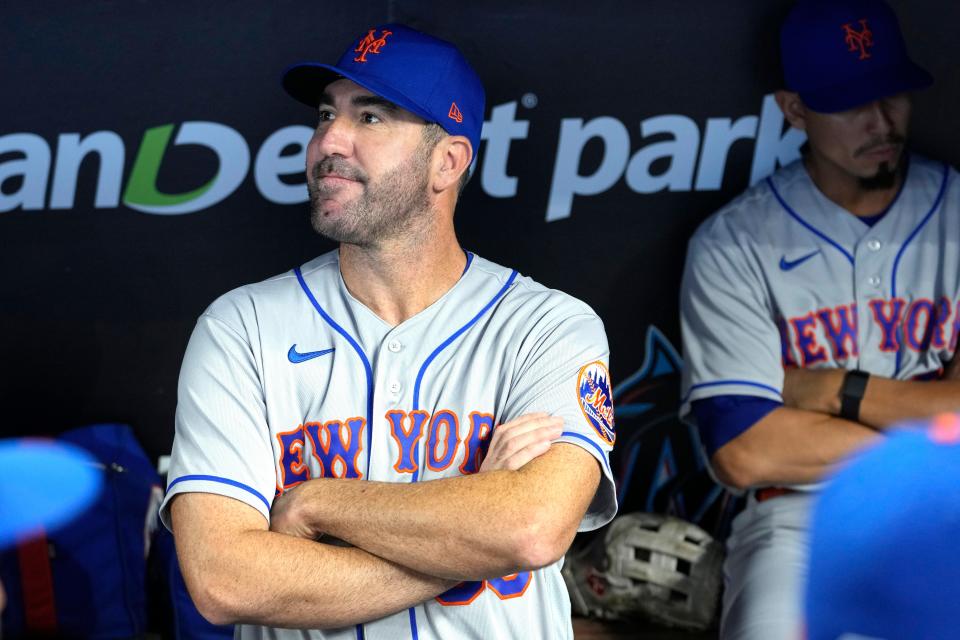 New York Mets pitcher Justin Verlander looks out from the dugout before an opening day baseball game against the Miami Marlins, Thursday, March 30, 2023, in Miami. (AP Photo/Lynne Sladky)