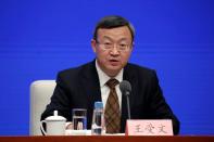 Chinese Vice Commerce Minister and Deputy International Trade Representative Wang Shouwen attends a news conference on the state of trade negotiations with U.S. in Beijing