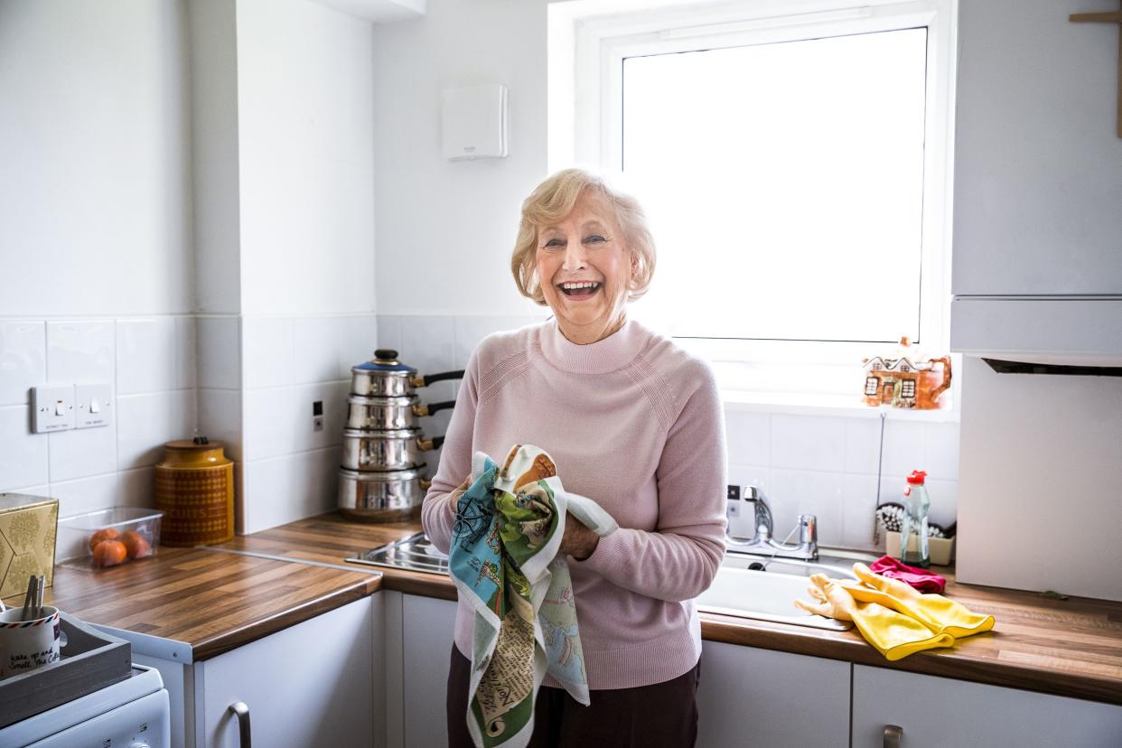 smiling senior woman in her kitchen