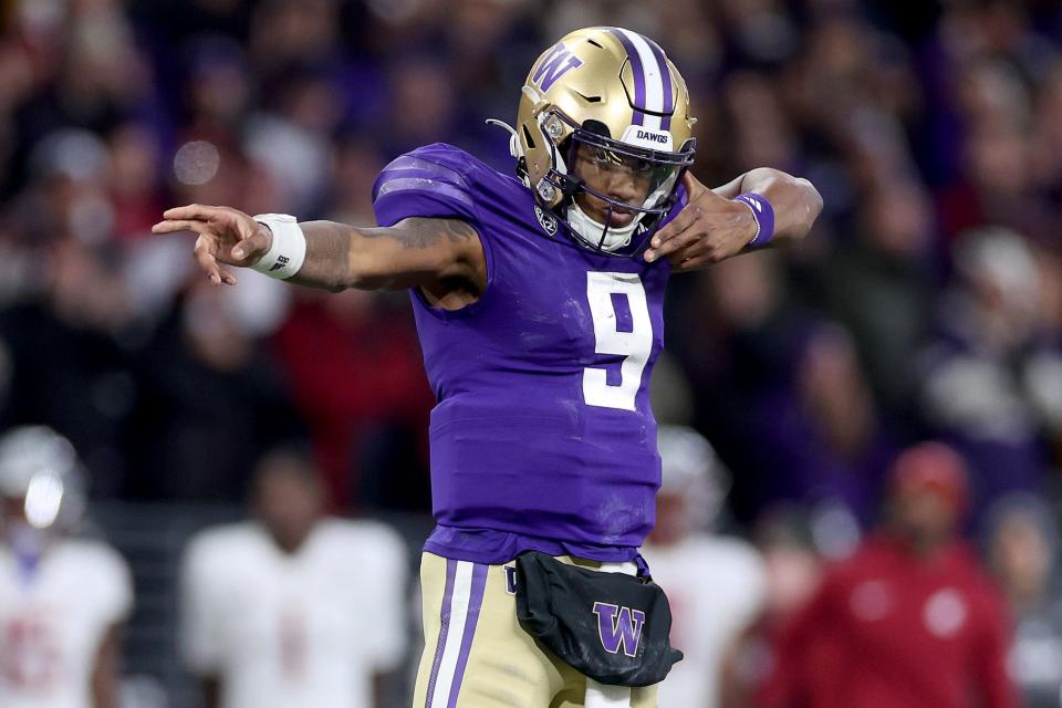 Michael Penix Jr. #9 of the Washington Huskies reacts after a first down against the Washington State Cougars during the fourth quarter at Husky Stadium on November 25, 2023 in Seattle, Washington.