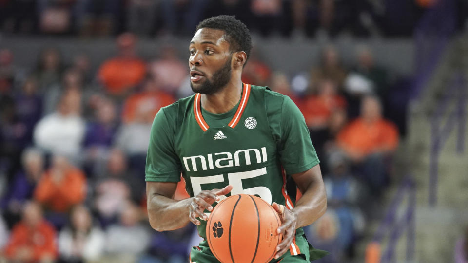 Miami guard Wooga Poplar surveys the defense during the second half of an NCAA college basketball game against Clemson Saturday, Feb. 4, 2023, in Clemson, S.C. Miami won 78-74. (AP Photo/Sean Rayford)